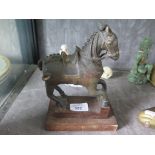 A 19th century Chinese bronze figure of a horse, on a later stand (parts missing) 21cm high