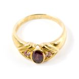 A 9 carat gold garnet and pink sapphire ring, with certificate