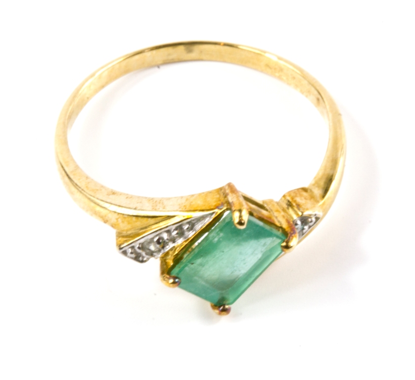 A 9 carat gold emerald and diamond ring, with certificate