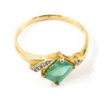 A 9 carat gold emerald and diamond ring, with certificate