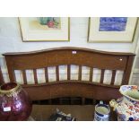 An Edwardian inlaid mahogany pair of bedends, the shaped tops over husk swag and ribbon