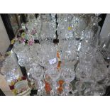 Three cut glass decanters, various cut and other drinking glasses and four posy baskets