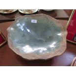 A Phyllis Sherwood blue glaze dish of organic form, signed on the base, 36cm diameter