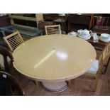 An Italian style maple wood circular dining table with metal inserts, and vase shape stem, 130cm