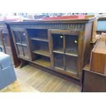 An oak dresser rack, with fluted frieze, open shelves and two glazed doors, 154cm wide, 103cm high