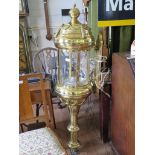 A pair of large brass wall lanterns of cylindrical form with applied swags and pendant bases,