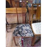 A late Victorian mahogany and mother of pearl inlaid bedroom chair, with foliate motif top rail,