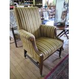 An Edwardian mahogany and satinwood crossbanded upholstered armchair, with patera inlaid arm