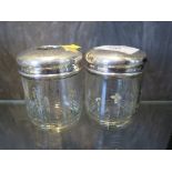 Three silver topped glass jars