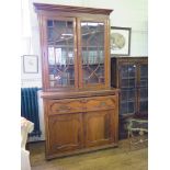 A Victorian walnut secretaire bookcase, with astragal glazed doors over a panelled and fitted