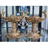 A pair of Louis XIV style gilt metal tazzas, the boat form dishes with masks, figural handles and