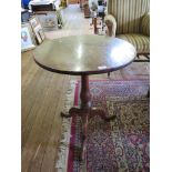 A George III mahogany tripod table, with circular top, baluster stem and cabriole legs, 61cm