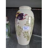 A Moorcroft limited edition Aquilegia design vase with a cream ground, no. 1 of 200 pieces,