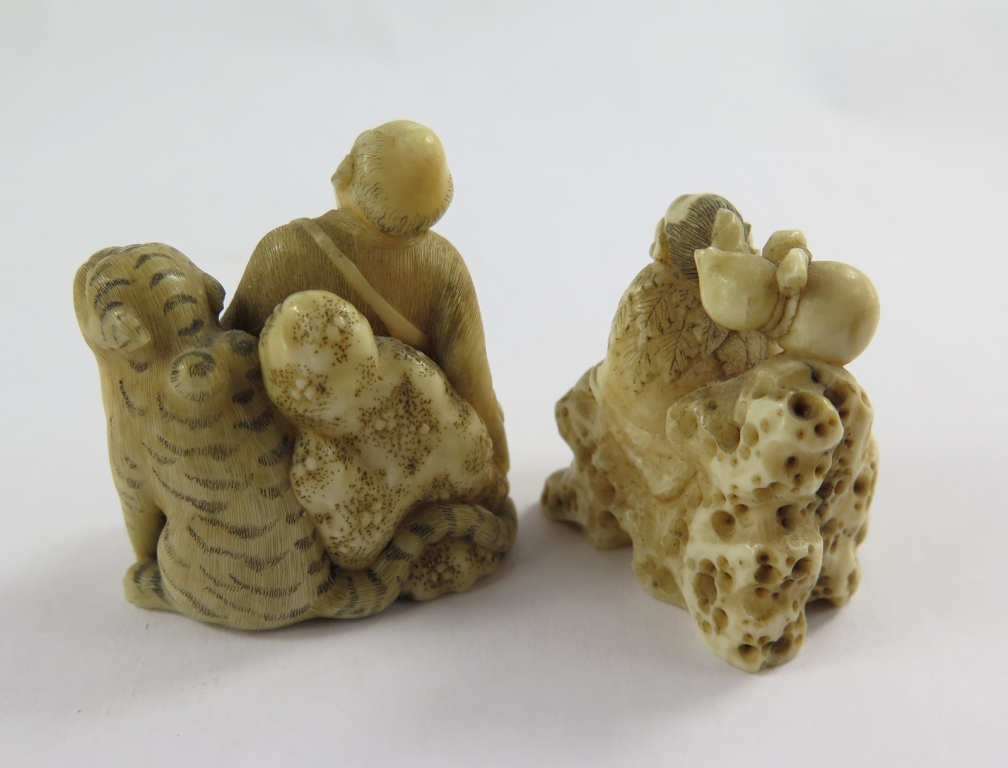Two Meiji period ivory Netsuke, one depicting a man sitting with a tiger, the other of a man sitting - Image 2 of 2