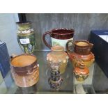 A Doulton Lambeth stoneware pepperette 8.5cm high and vase 17cm high and various other stonewares