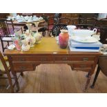 An Edwardian lady's writing table, the leather inset top over four drawers on ring turned legs and