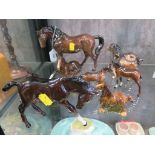 Two Beswick figures of ponies, another miniature of a horse, 9cm high, three Royal Doulton figures