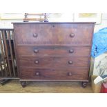 An early 19th century mahogany chest of drawers, the hinged top with dummy secretaire front over