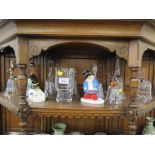 Two Coalport figures of Paddington Bear, a collection of glass bells and various Wedgwood green