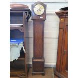 An oak Grandmother clock, with arched case, silvered dial and associated movement