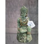 A Mayan seated figure, moulded in jade fragments 15cm high
