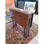 A Victorian walnut Sutherland table with bobbin turned legs and stretchers, 60cm wide, 60cm high