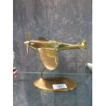 A brass model of a spitfire, on a stand, made by Bates Brass of Birmingham, 19cm long