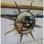 A 1960's convex wall mirror of star design 64cm diameter