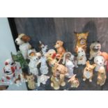 A collection of model dogs, including Staffordshire, Sylvac and others