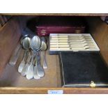 A pair of silver plated tea spoons, together with a boxed set of spoons, forks and some dessert