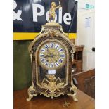 A 19th century French Boullework and ormolu mounted bracket clock, surmounted by a putti holding a