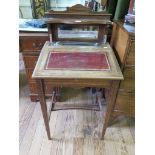 An Edwardian inlaid rosewood desk, with mirrored shelf back, sloping leather lined hinged surface