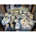 A collection of Honiton and Poole wares, including jugs, jam pots, vases, plates and egg cups