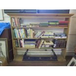 A pine open bookshelf, with moulded top and four shelves, 153cm wide, 126cm high