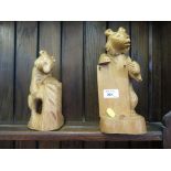 Two wood carved Russian bears, one modelled for holding a notepad, the other as a pen holder