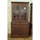 An Edwardian bookcase cabinet, the moulded cornice over astragal glazed doors and two frieze drawers