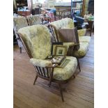 An Ercol Windsor design two seat settee and armchair, in stained beech 1980's (2)