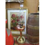 A brass and copper column oil lamp 63cm high