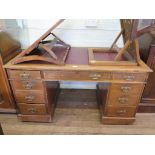 An Edwardian mahogany pedestal desk, with leather inset top over three drawers above pedestals