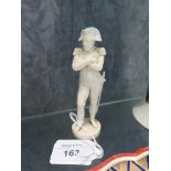 A Dieppe ivory figure of Napoleon, in full uniform with his arms folded, on a circular base, 10.