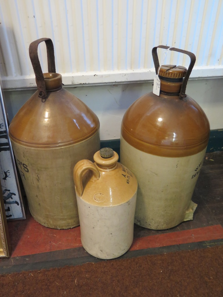 Two Devon Cider stoneware flagons and another for A. Matthews, 65-71 Elm Park Road, Reading (3)