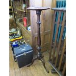 A mahogany torchere stand with baluster stem and tripod base 105cm high, and a Victorian toilet