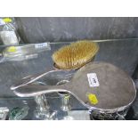 A two piece silver ladies brush and mirror