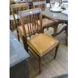 A set of six mahogany dining chairs, with rail backs, drop in seats and square tapering legs with