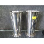 A pair of silver plated beakers