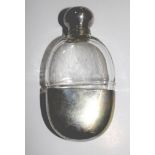 A small glass and silver plated spirit flask