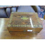 A Regency rosewood and brass inlaid sewing box, with stylised foliate inlay and fitted interior,