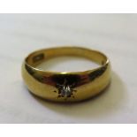 A gypsy set ring, the small diamond in 18 carat gold