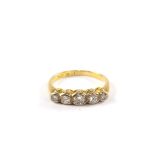 A five stone diamond ring set in 18 carat gold and platinum