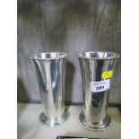 A pair of silver plated beakers